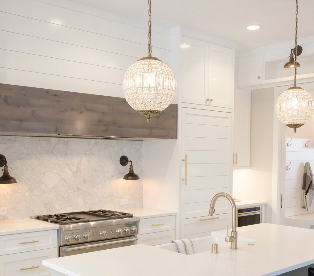 brightly lit kitchen with long hanging lights