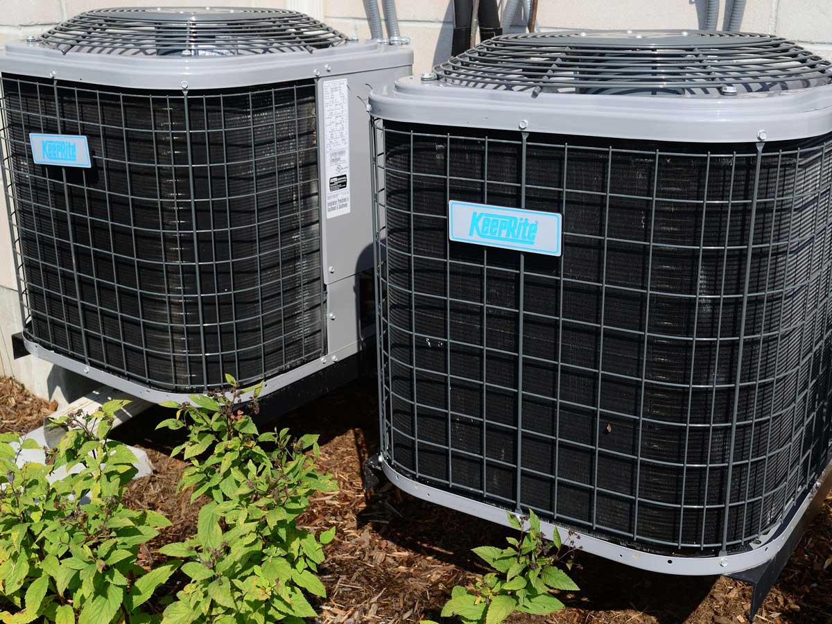 two HVAC systems outside residential house