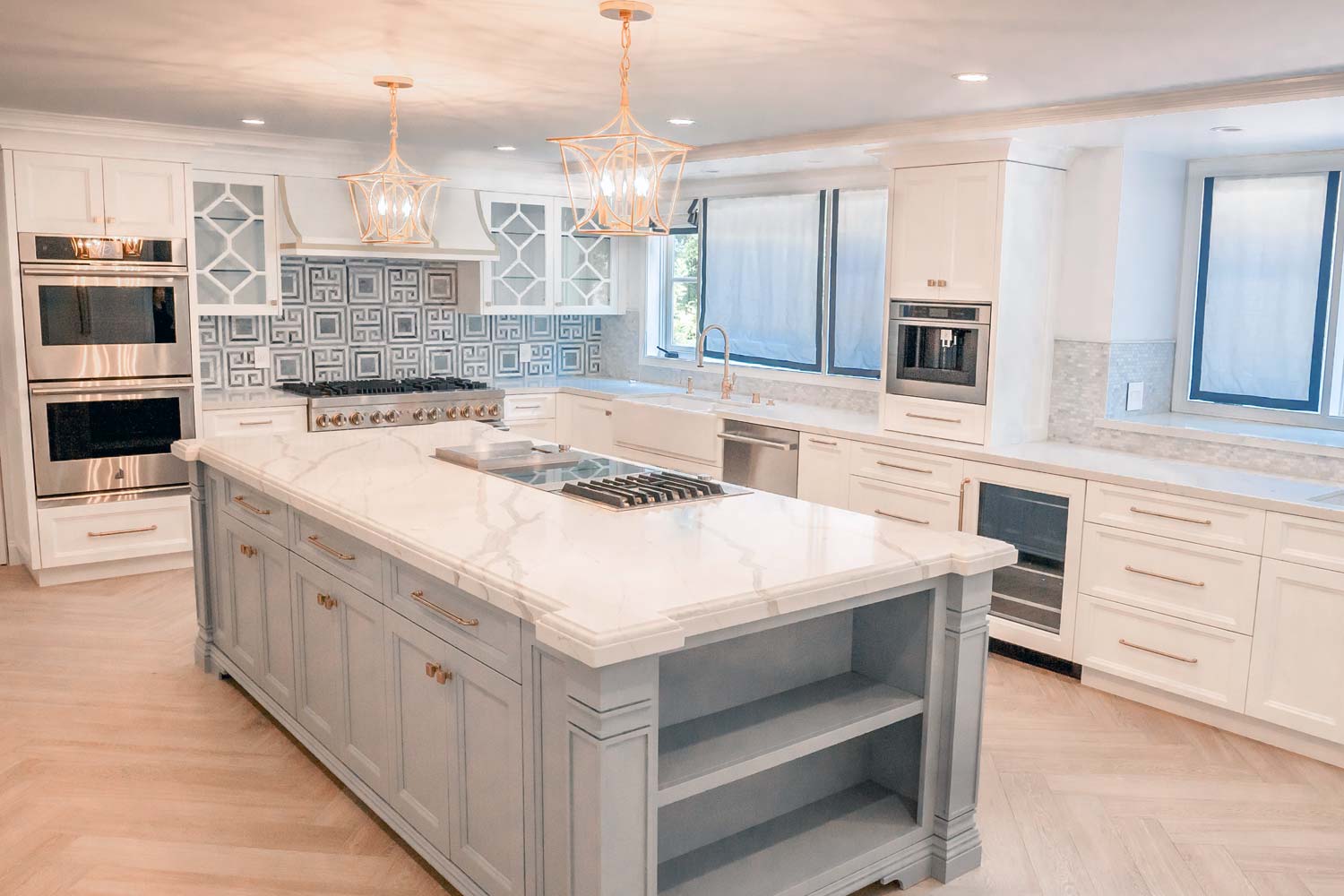 brightly lit kitchen with long hanging lights