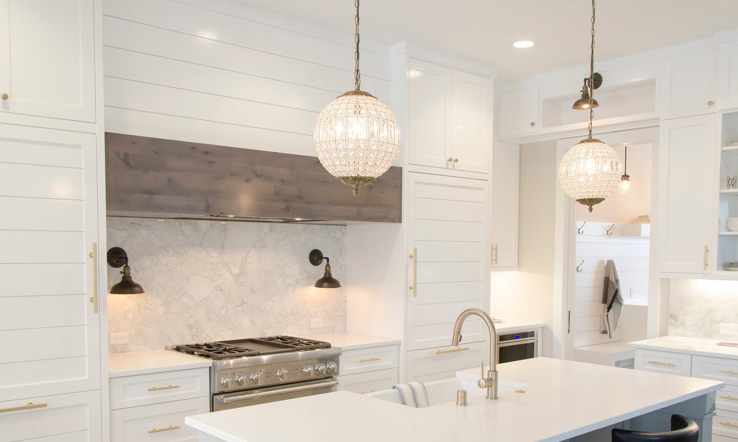 brightly lit kitchen with long hanging lights