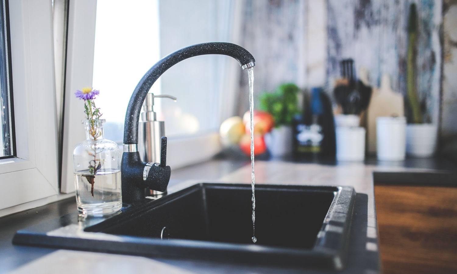 running faucet in kitchen