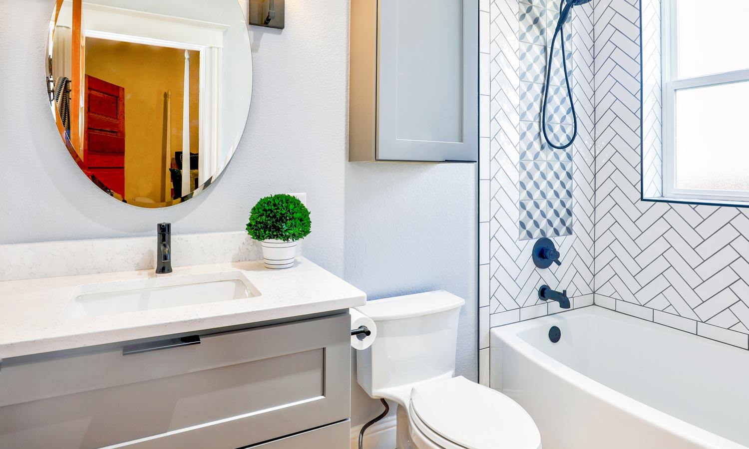 brightly lit bathroom with blue accents in decor