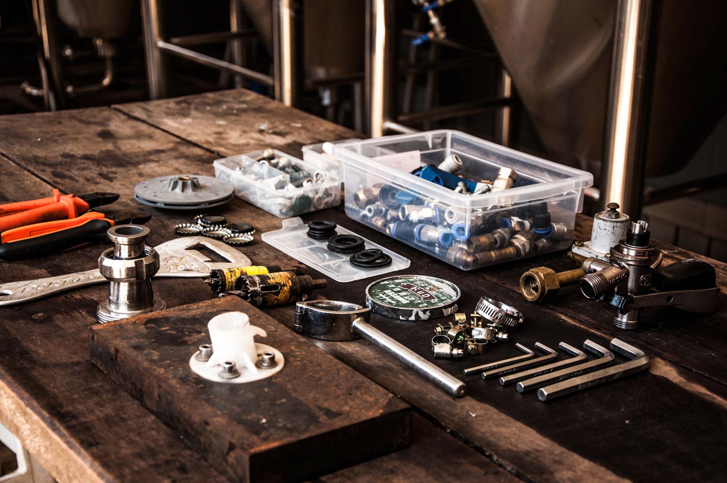 plumbing tools displayed on wooden desk table